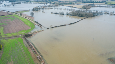 A photograph of the River Severn, having flooded into neighbouring fields and farmland.